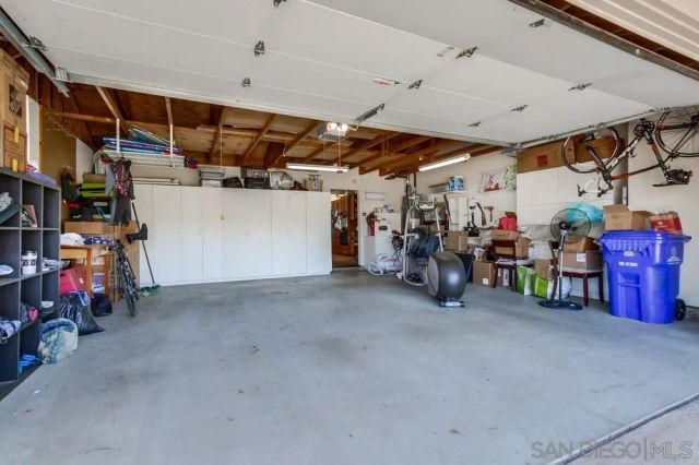 a view of a patio with couches table and chairs and potted plants