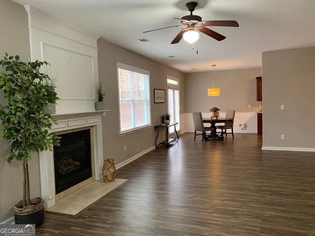 a view of dining room with furniture window and wooden floor