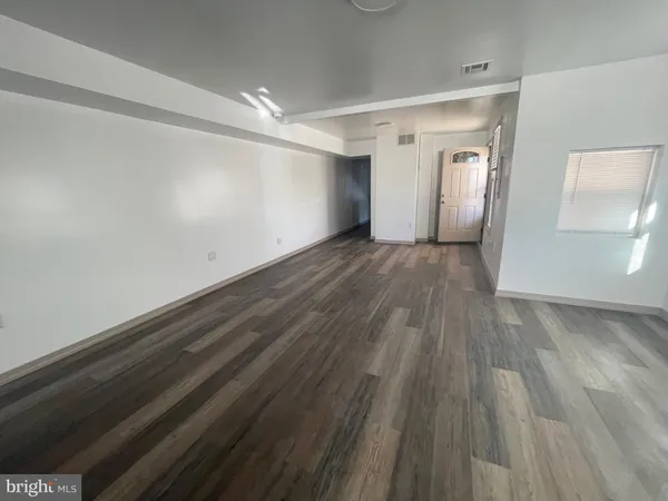 a bathroom with a toilet and a mirror