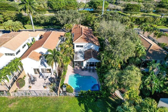 an aerial view of residential house with outdoor space and swimming pool