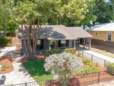 a front view of a house with garden