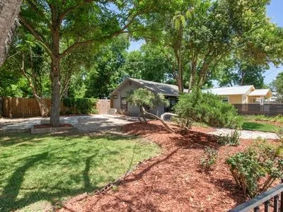 a view of a backyard with a patio