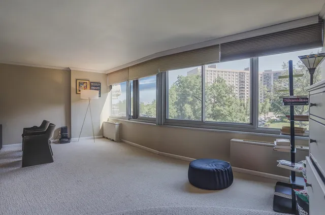 a room with furniture and a large window