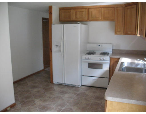 5 Bretton Road Springfield, MA 01119 - Photo 4 of 8 a kitchen with a refrigerator and a stove