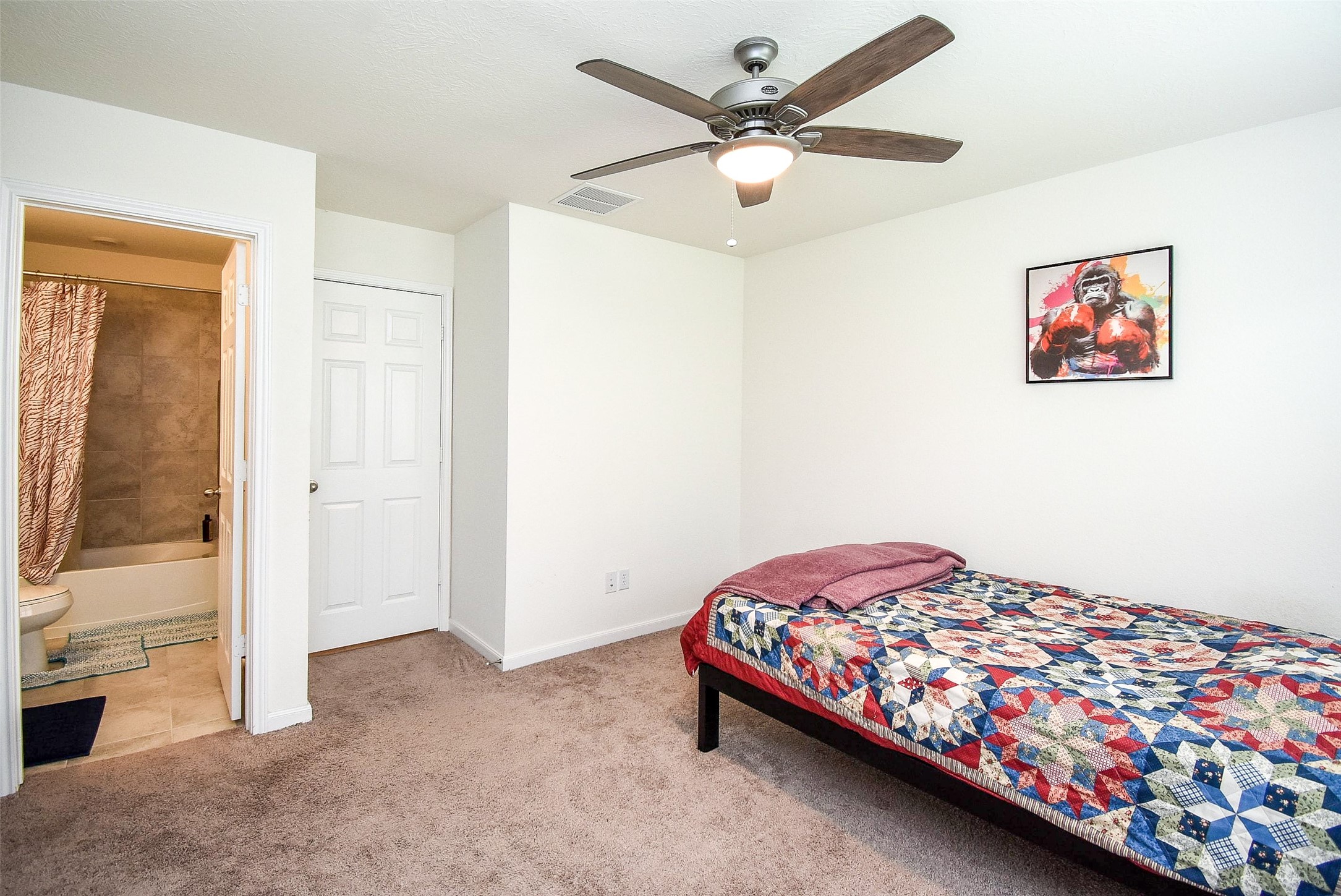 5912 Whitewing Road Rosenberg, TX 77469 - Photo 23 of 25 a bedroom with a bed and a view of livingroom