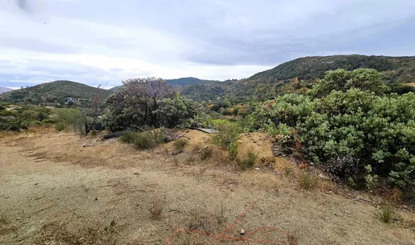 a view of a lake with mountains in the background