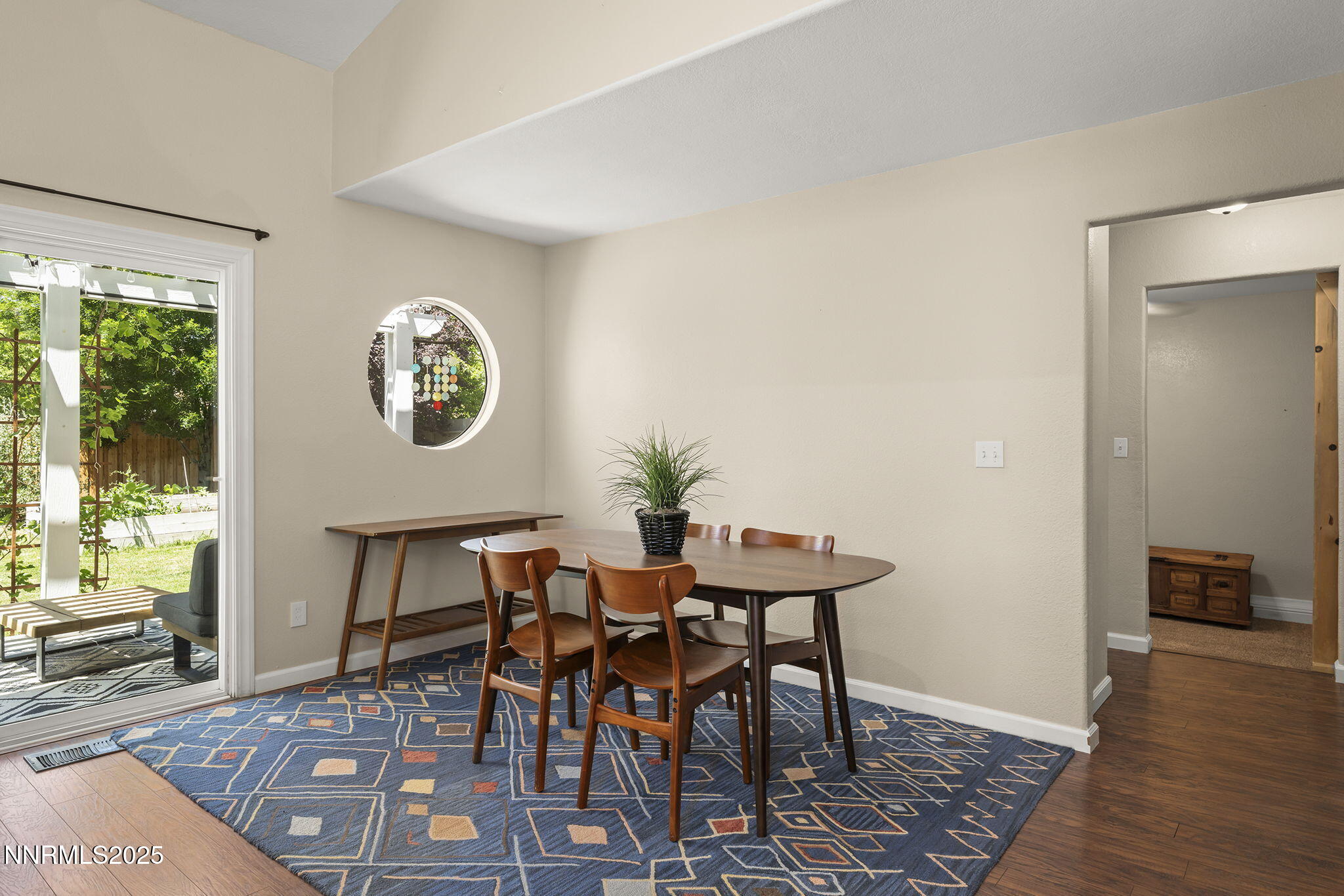 9783 Northrup Drive Reno, NV 89521 - Photo 12 of 39 a view of a dining room with furniture and wooden floor