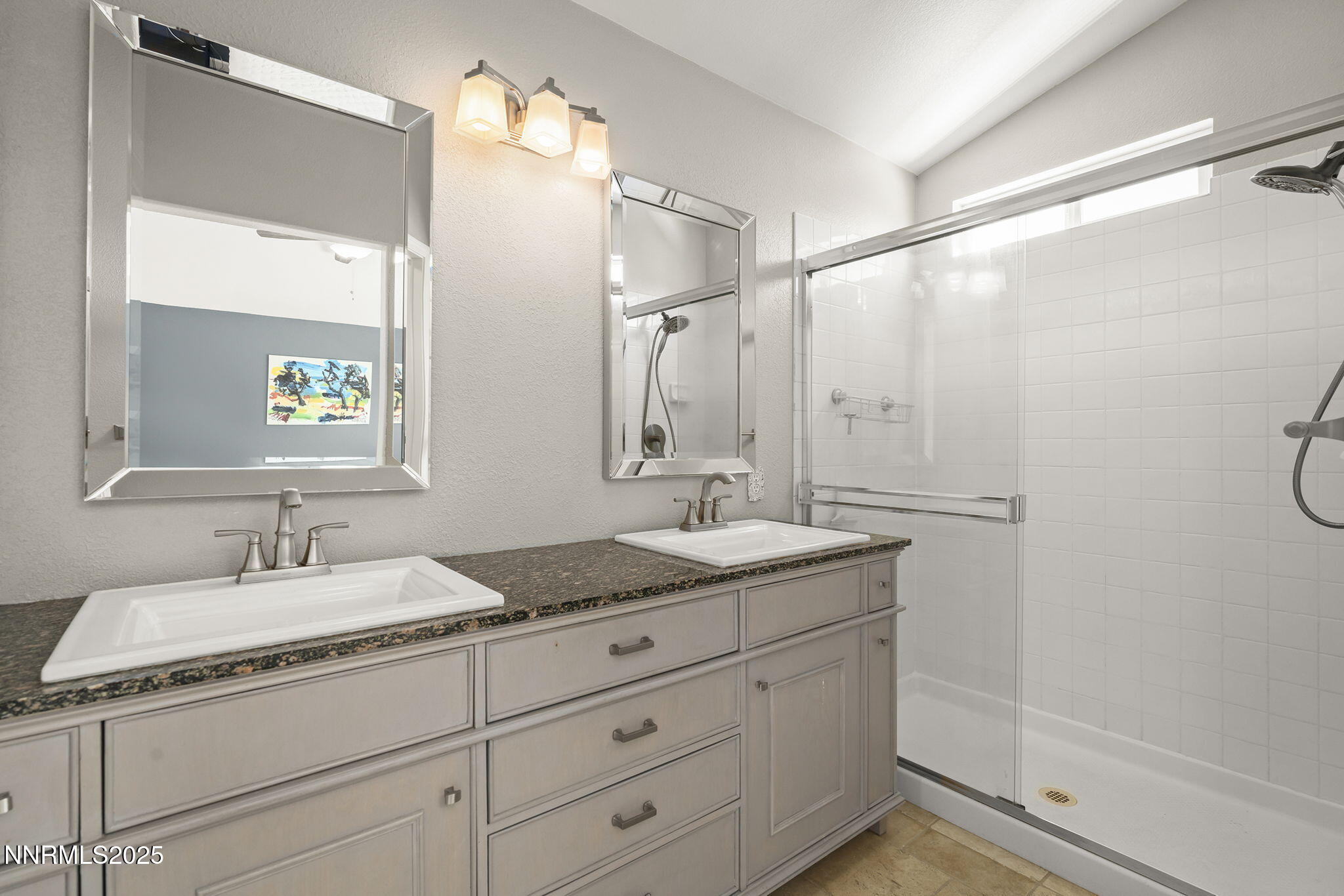 9783 Northrup Drive Reno, NV 89521 - Photo 20 of 39 a bathroom with a granite countertop sink mirror and double