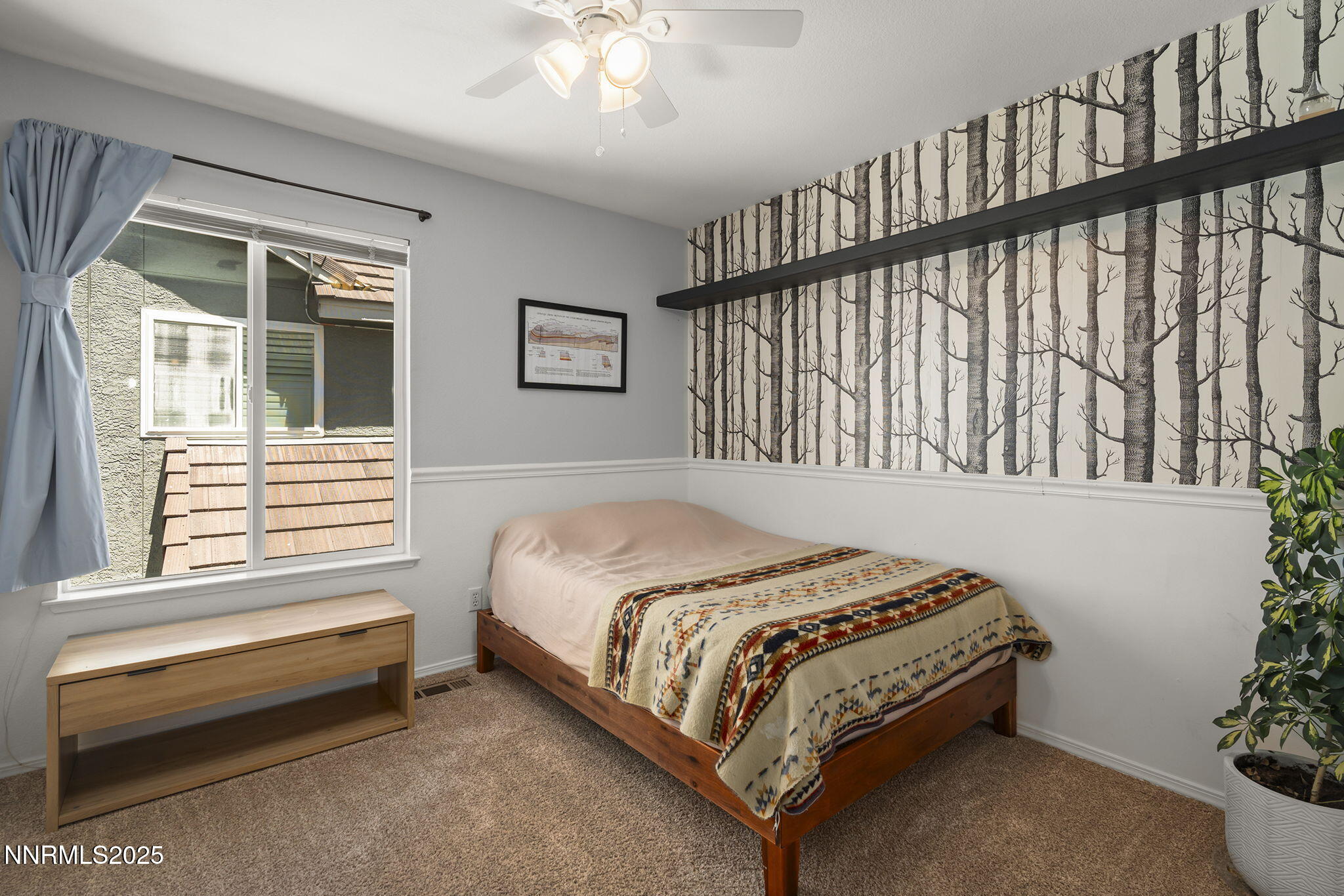 9783 Northrup Drive Reno, NV 89521 - Photo 21 of 39 a bedroom with a bed and a window