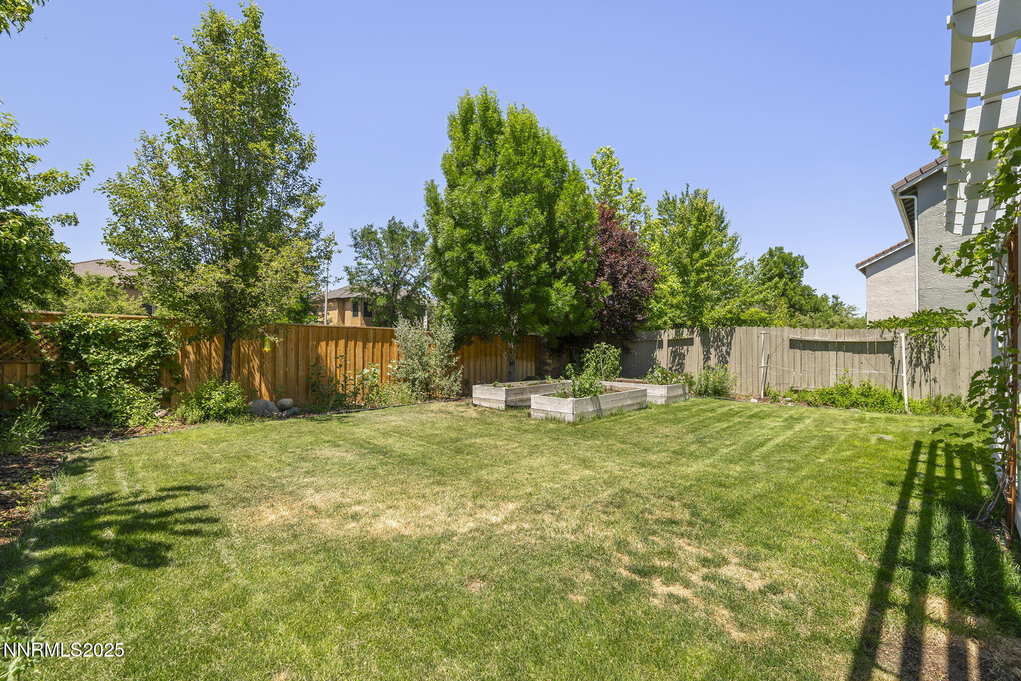 9783 Northrup Drive Reno, NV 89521 - Photo 27 of 39 a house with trees in the background