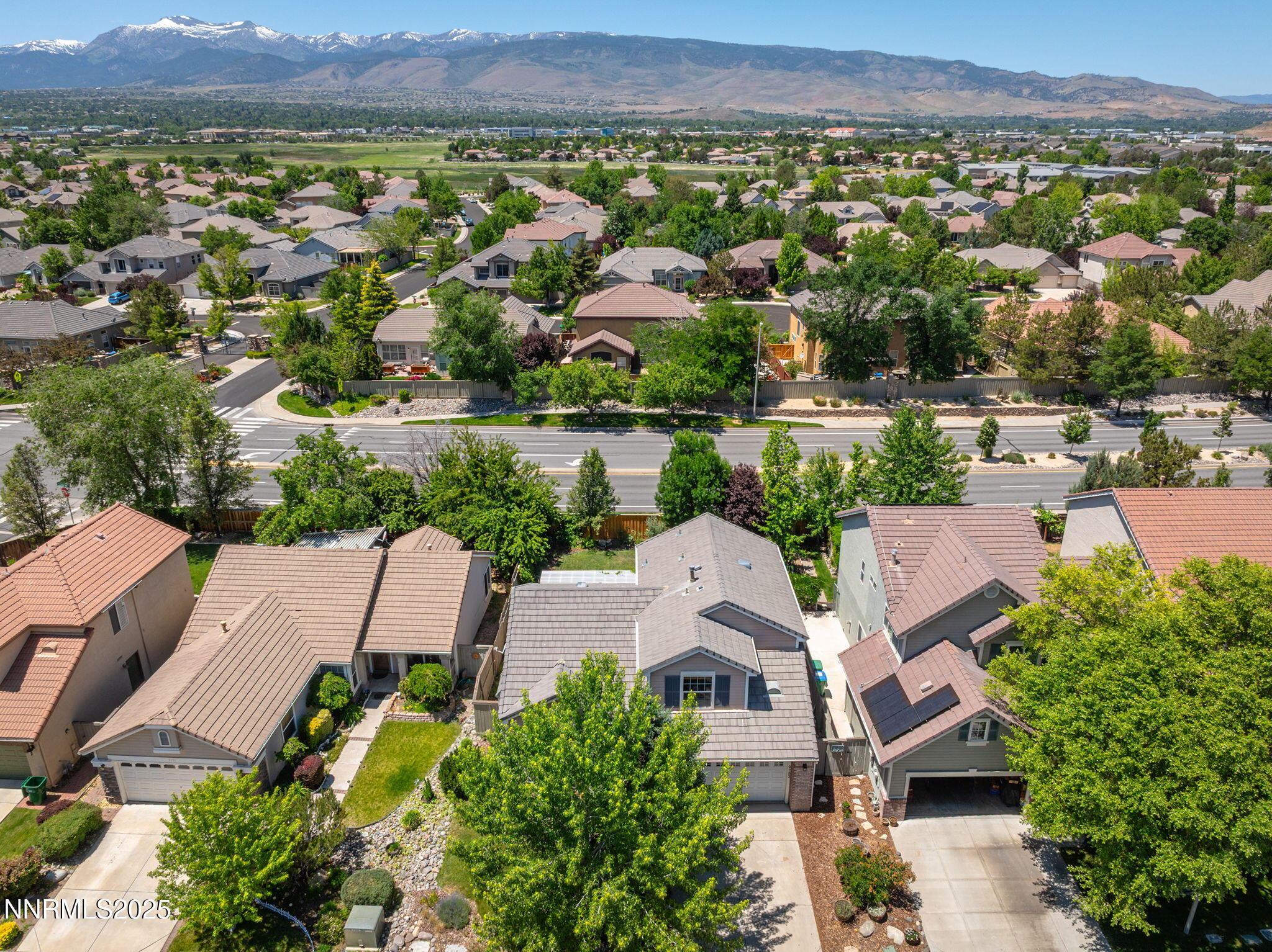 9783 Northrup Drive Reno, NV 89521 - Photo 3 of 39 an aerial view of a house with a lake view