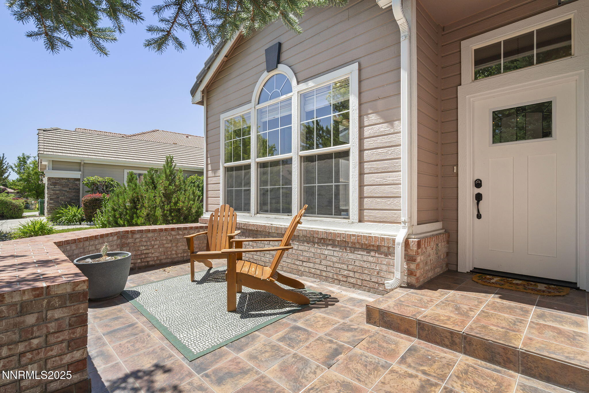 9783 Northrup Drive Reno, NV 89521 - Photo 5 of 39 a building outdoor space with patio furniture