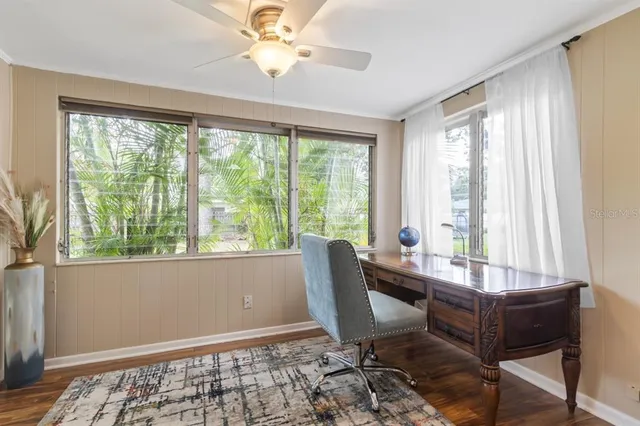 a living room with furniture and a window