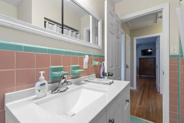 a bathroom with a sink and a mirror