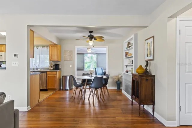 a view of a dining room with furniture window and wooden floor