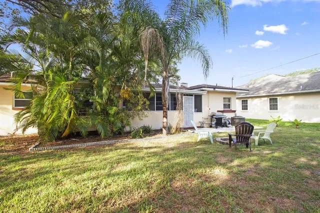 a front view of a house with a garden and porch