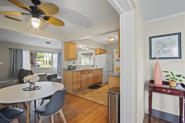 a kitchen with a table and chairs in it