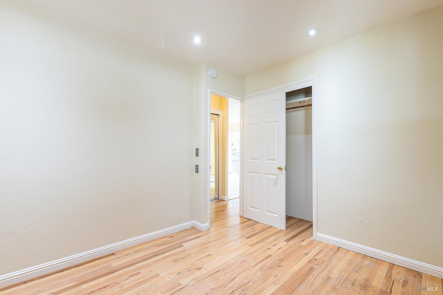 18090 Las Lomas Road Sonoma, CA 95476 - Photo 24 of 37 a view of empty room with wooden floor and entryway