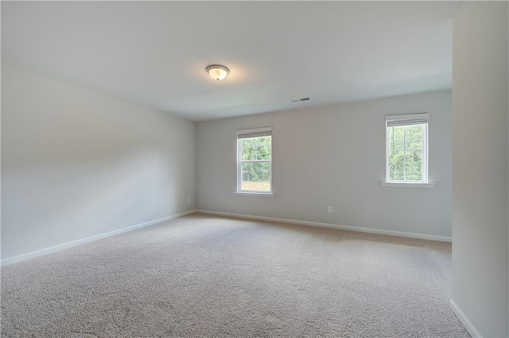 419993 St Anne's Place Covington, GA 30016 - Photo 18 of 30 an empty room with windows