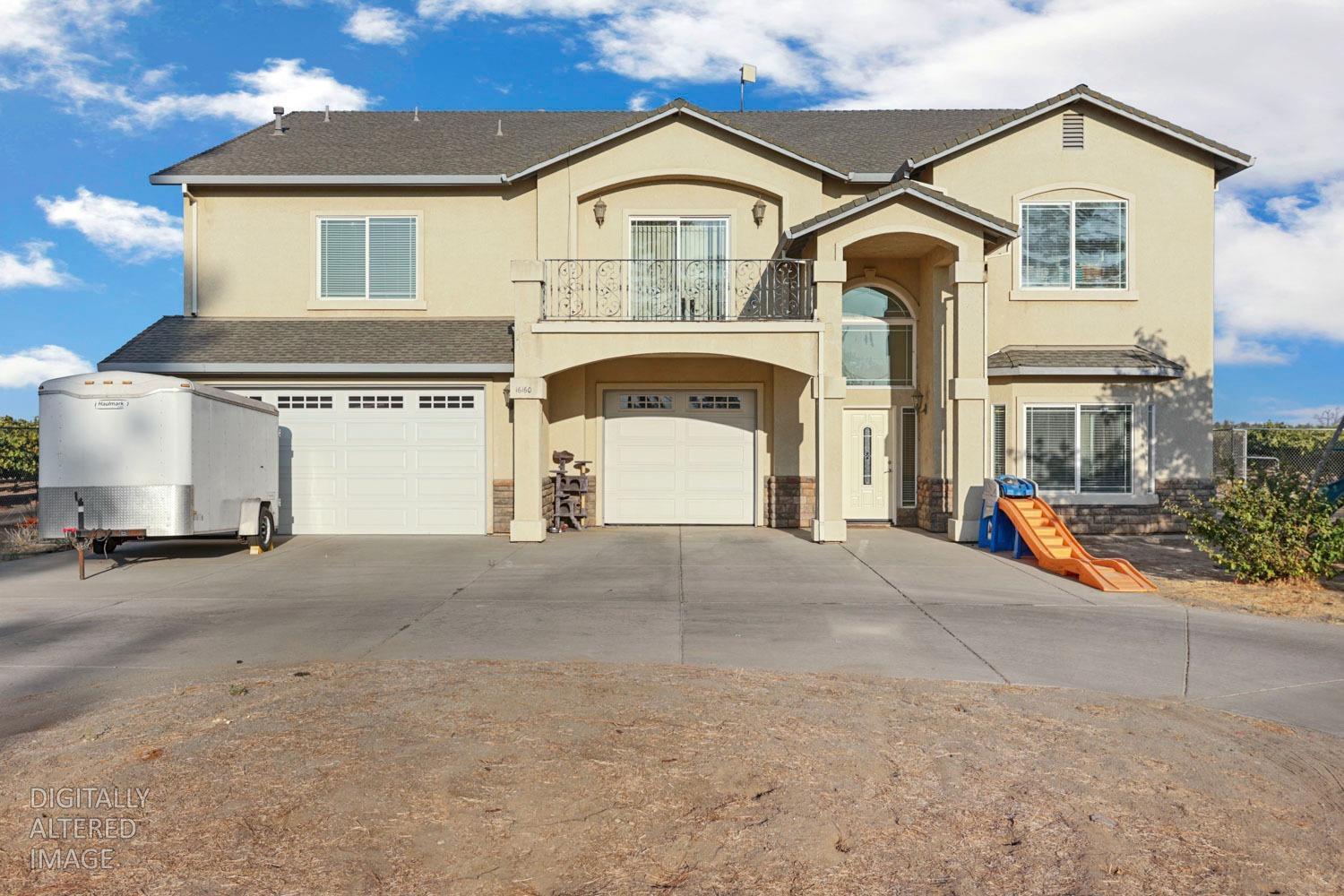 16160 Moore Road Lodi, CA 95242 - Photo 1 of 38 a front view of a house with a yard and garage