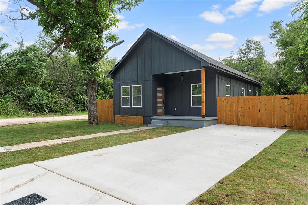 513 Maxfield Street Bellmead, TX 76705 - Photo 1 of 1 a front view of house with yard and trees