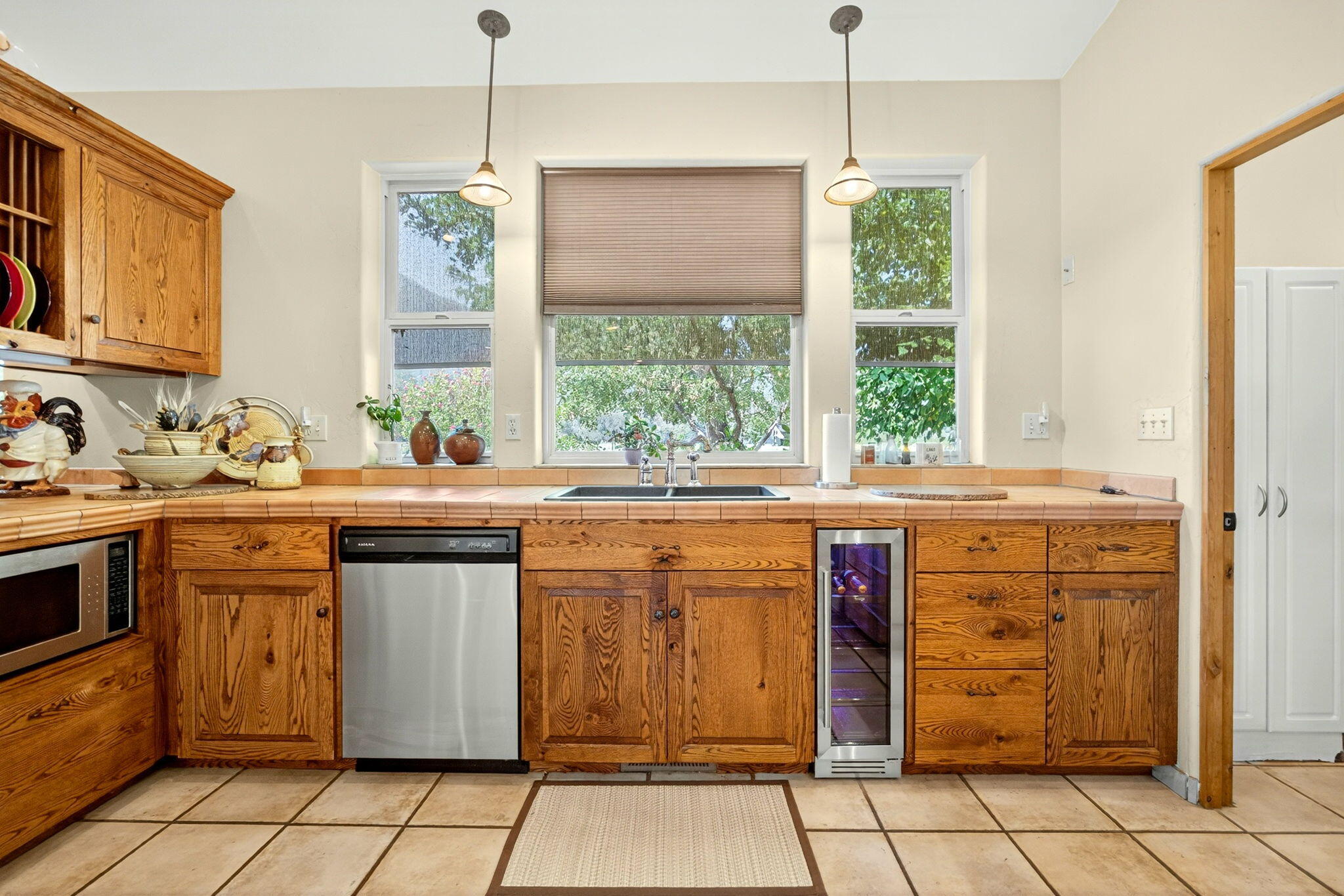 1176 Hamilton Road Jacksonville, OR 97530 - Photo 12 of 125 a kitchen with stainless steel appliances granite countertop a stove a sink and a window