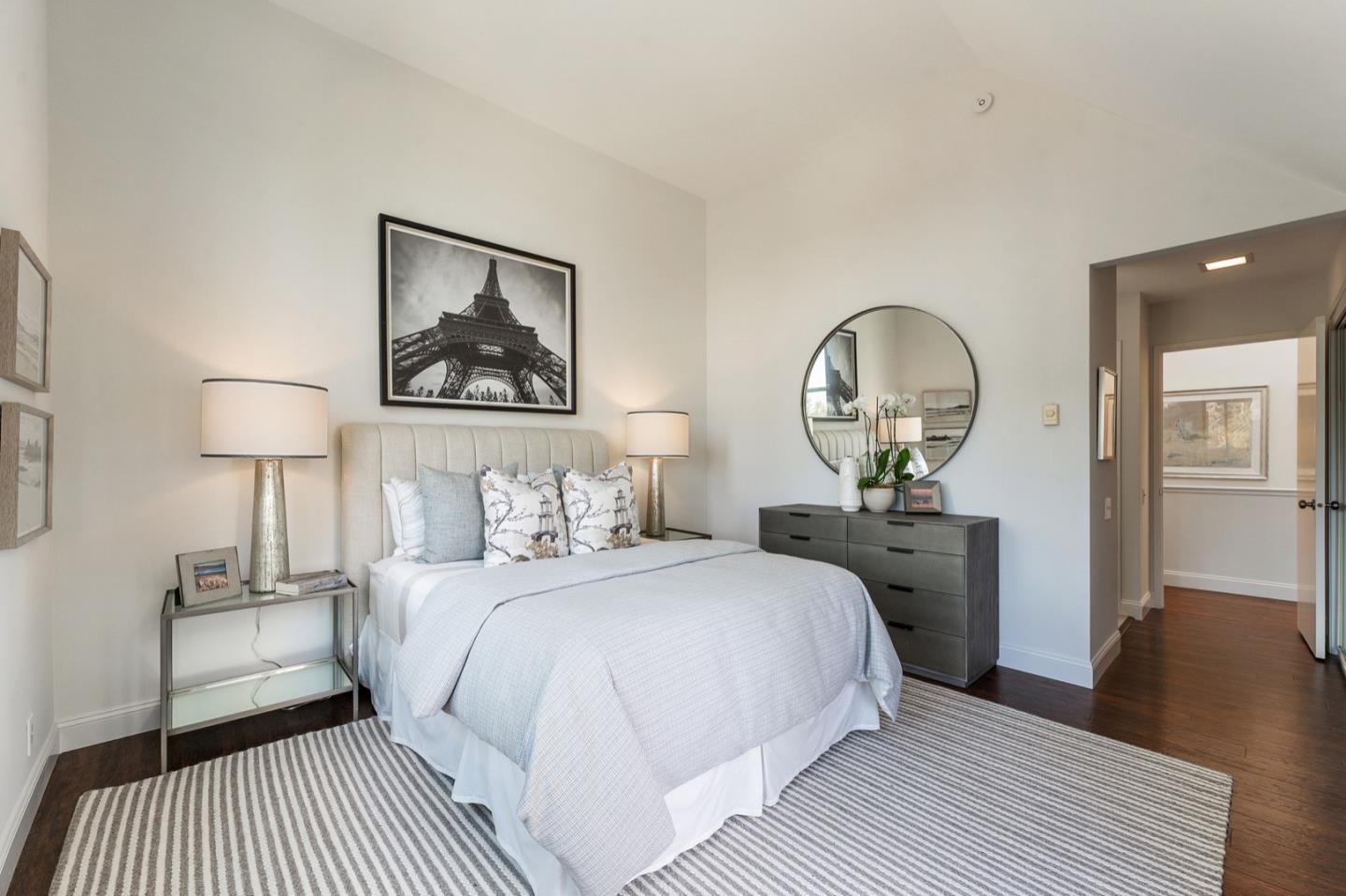 2345 Armada Way San Mateo, CA 94404 - Photo 15 of 32 a bedroom with a bed a mirror and lamp on table