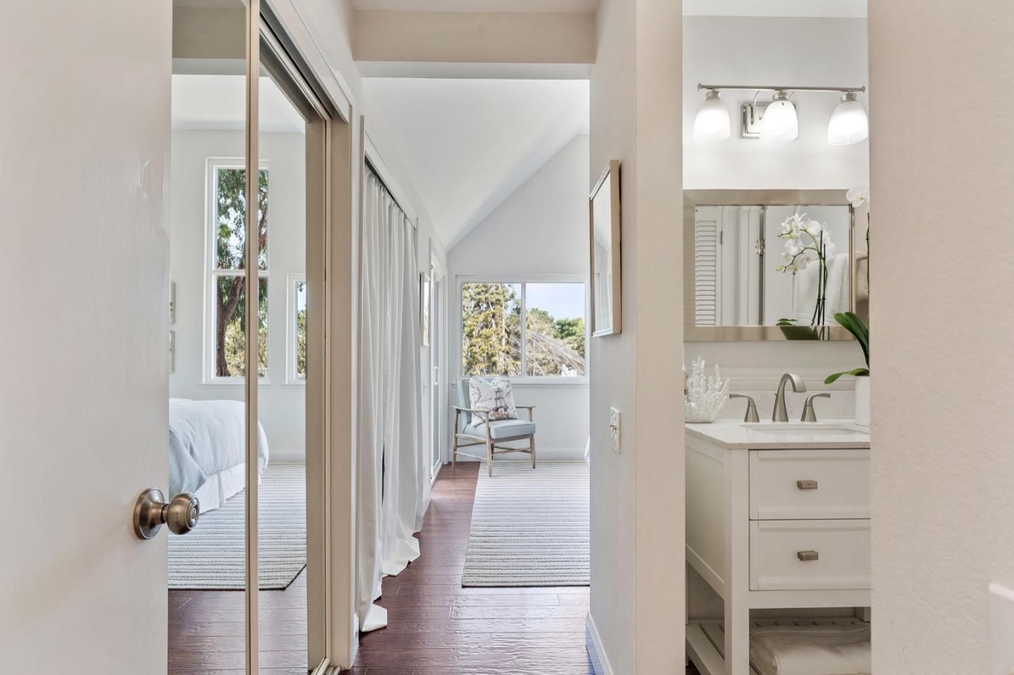 2345 Armada Way San Mateo, CA 94404 - Photo 16 of 32 a bathroom with a sink a mirror and a shower