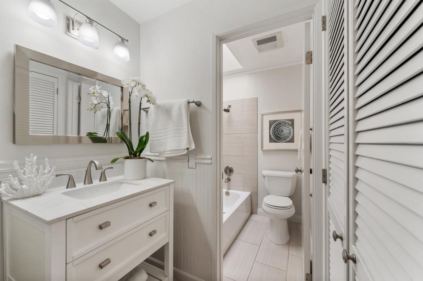 2345 Armada Way San Mateo, CA 94404 - Photo 17 of 32 a bathroom with a sink a toilet and shower