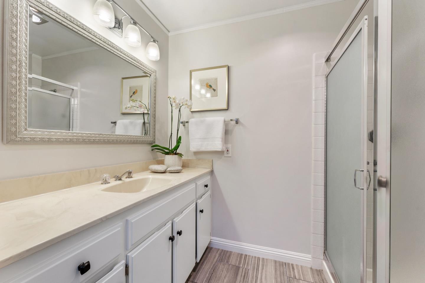 2345 Armada Way San Mateo, CA 94404 - Photo 22 of 32 a bathroom with a sink and a mirror