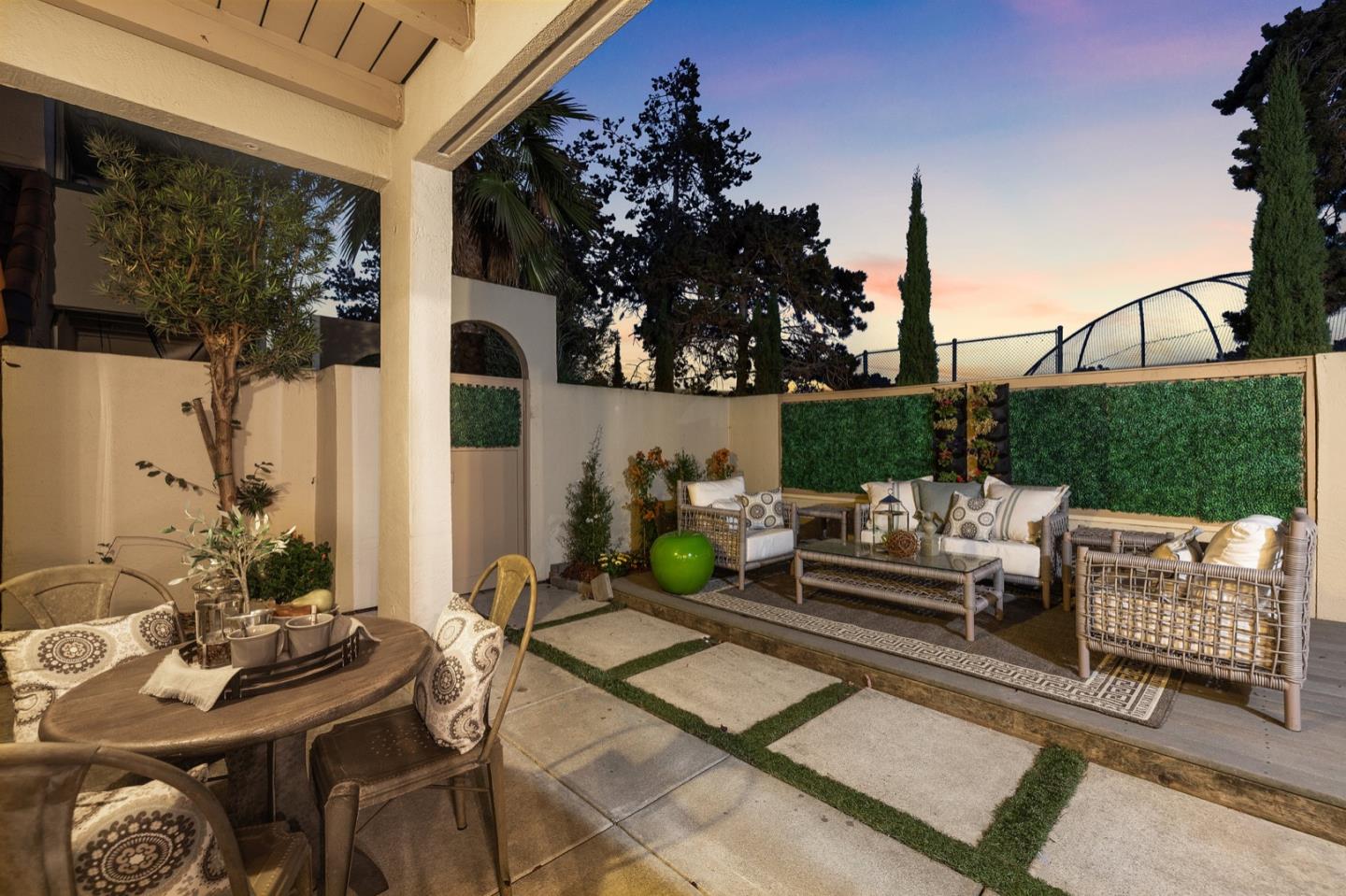 2345 Armada Way San Mateo, CA 94404 - Photo 26 of 32 a view of a patio with couches table and chairs with potted plants and big yard