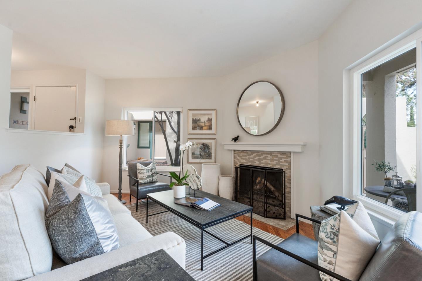 2345 Armada Way San Mateo, CA 94404 - Photo 7 of 32 a living room with furniture a fireplace and a large window
