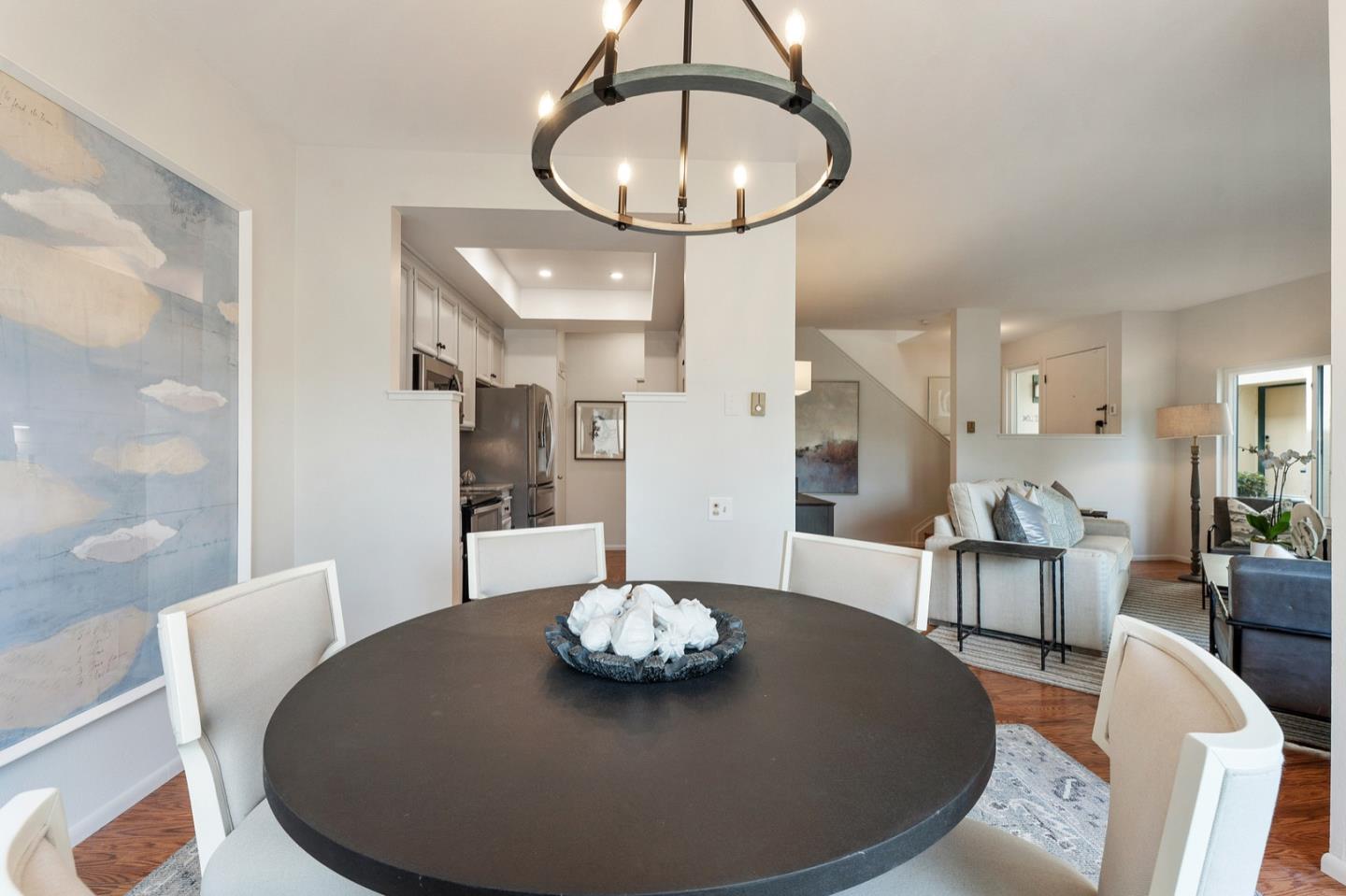 2345 Armada Way San Mateo, CA 94404 - Photo 9 of 32 a living room with furniture and a chandelier