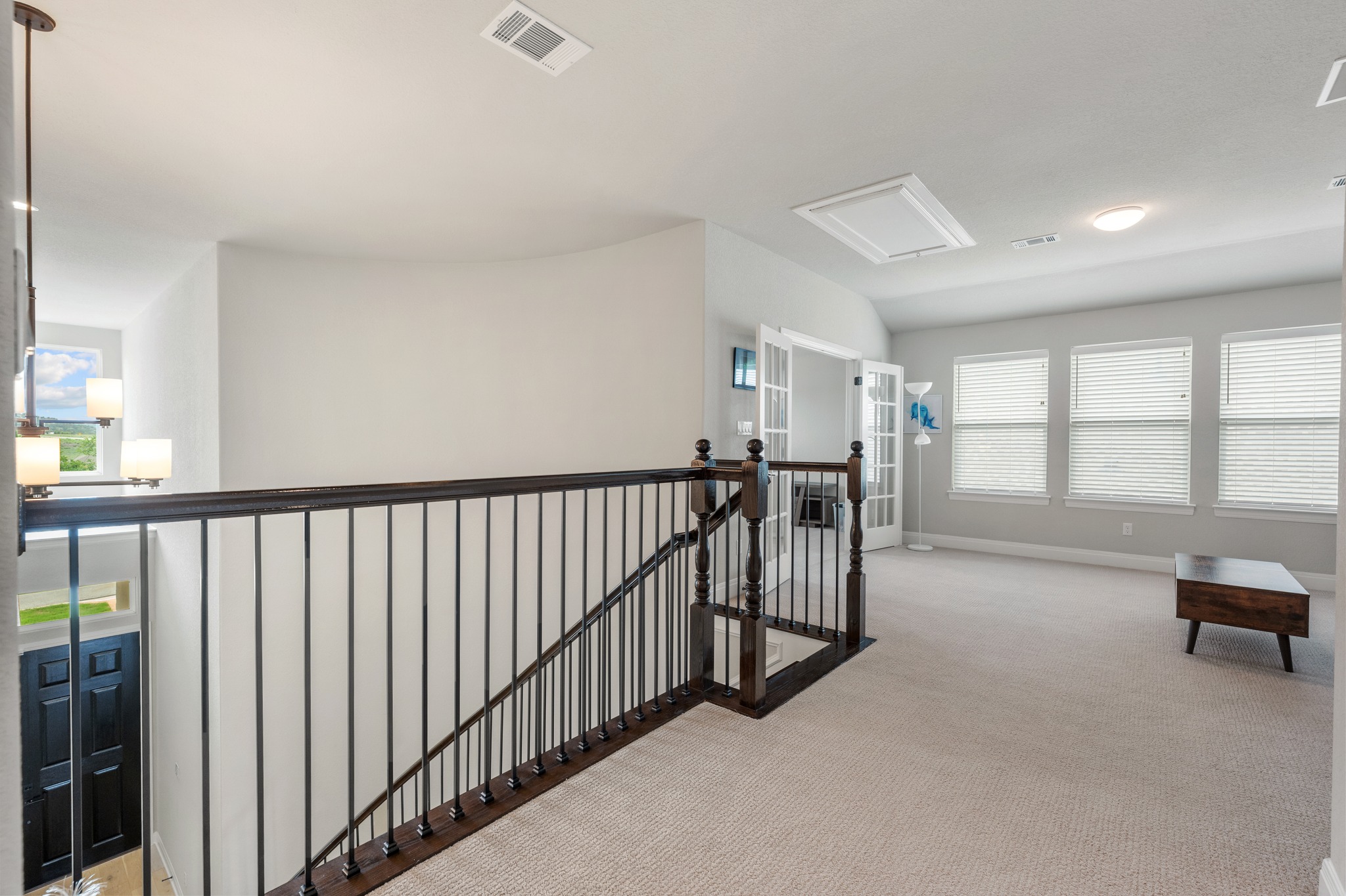 510 Elworth Path Austin, TX 78738 - Photo 18 of 40 a view of a hallway with windows