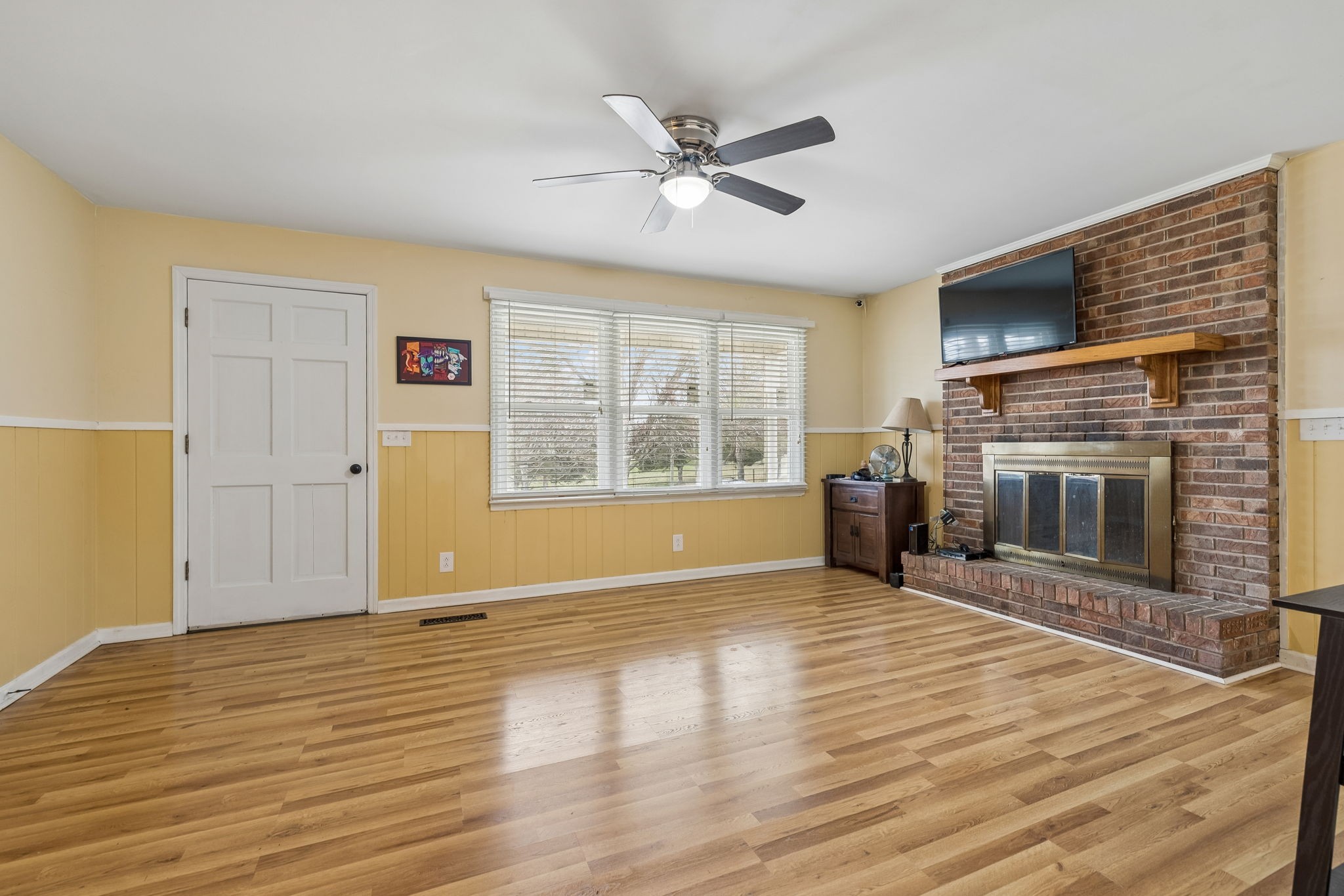 3669 Bluff Springs Road McMinnville, TN 37110 - Photo 12 of 51 a view of empty room with wooden floor and fireplace