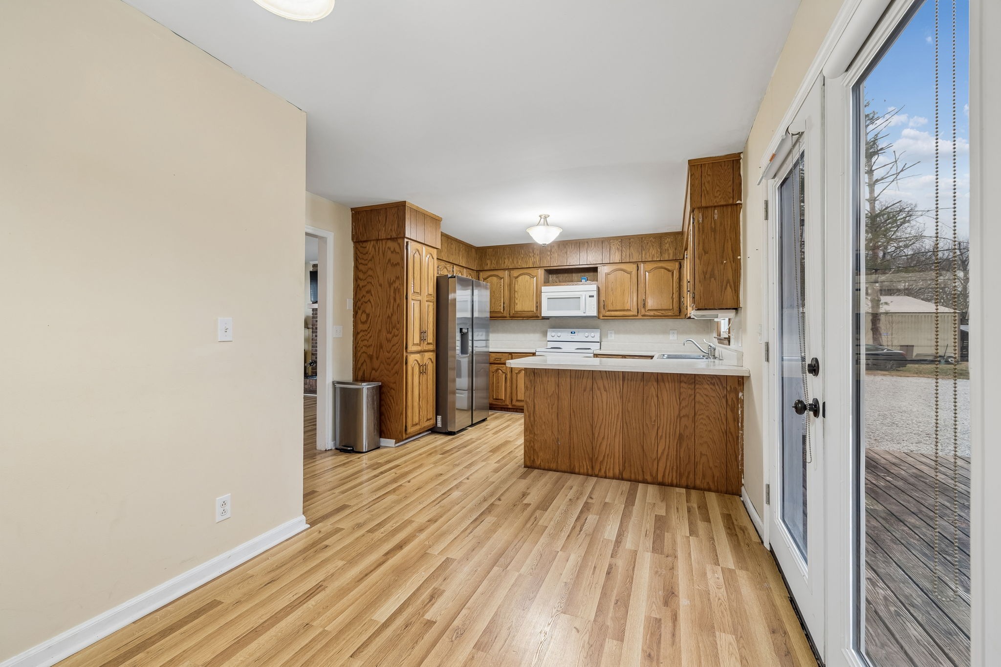 3669 Bluff Springs Road McMinnville, TN 37110 - Photo 15 of 51 a large kitchen with a lot of counter space and wooden floor