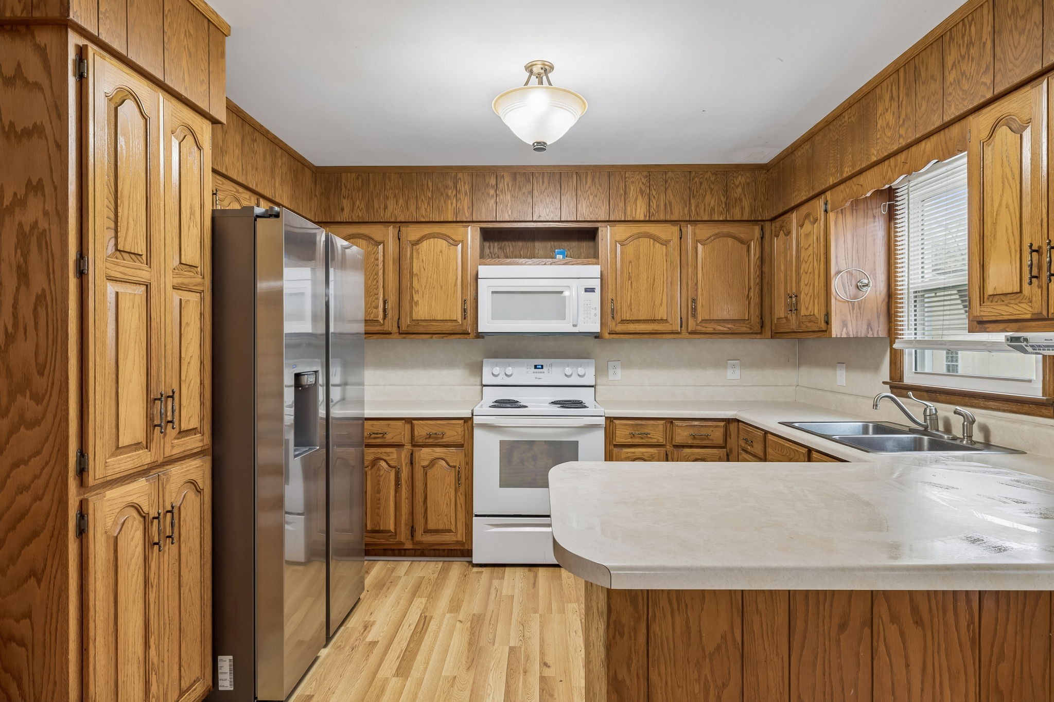 3669 Bluff Springs Road McMinnville, TN 37110 - Photo 17 of 51 a kitchen with stainless steel appliances granite countertop a stove a sink and a refrigerator