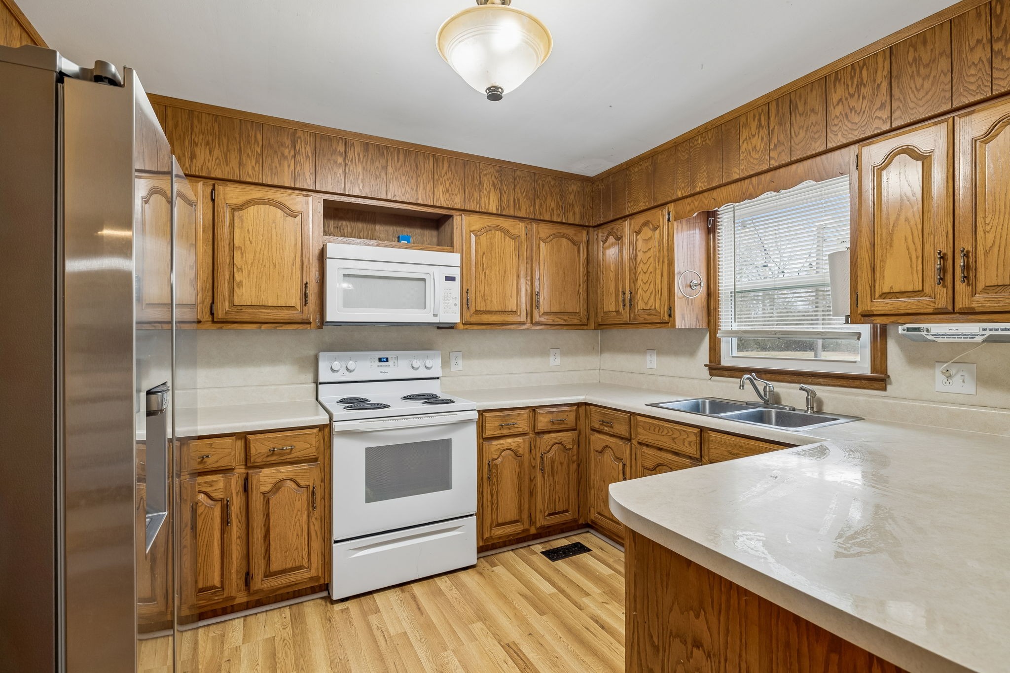 3669 Bluff Springs Road McMinnville, TN 37110 - Photo 18 of 51 a kitchen with stainless steel appliances granite countertop a sink a stove and refrigerator