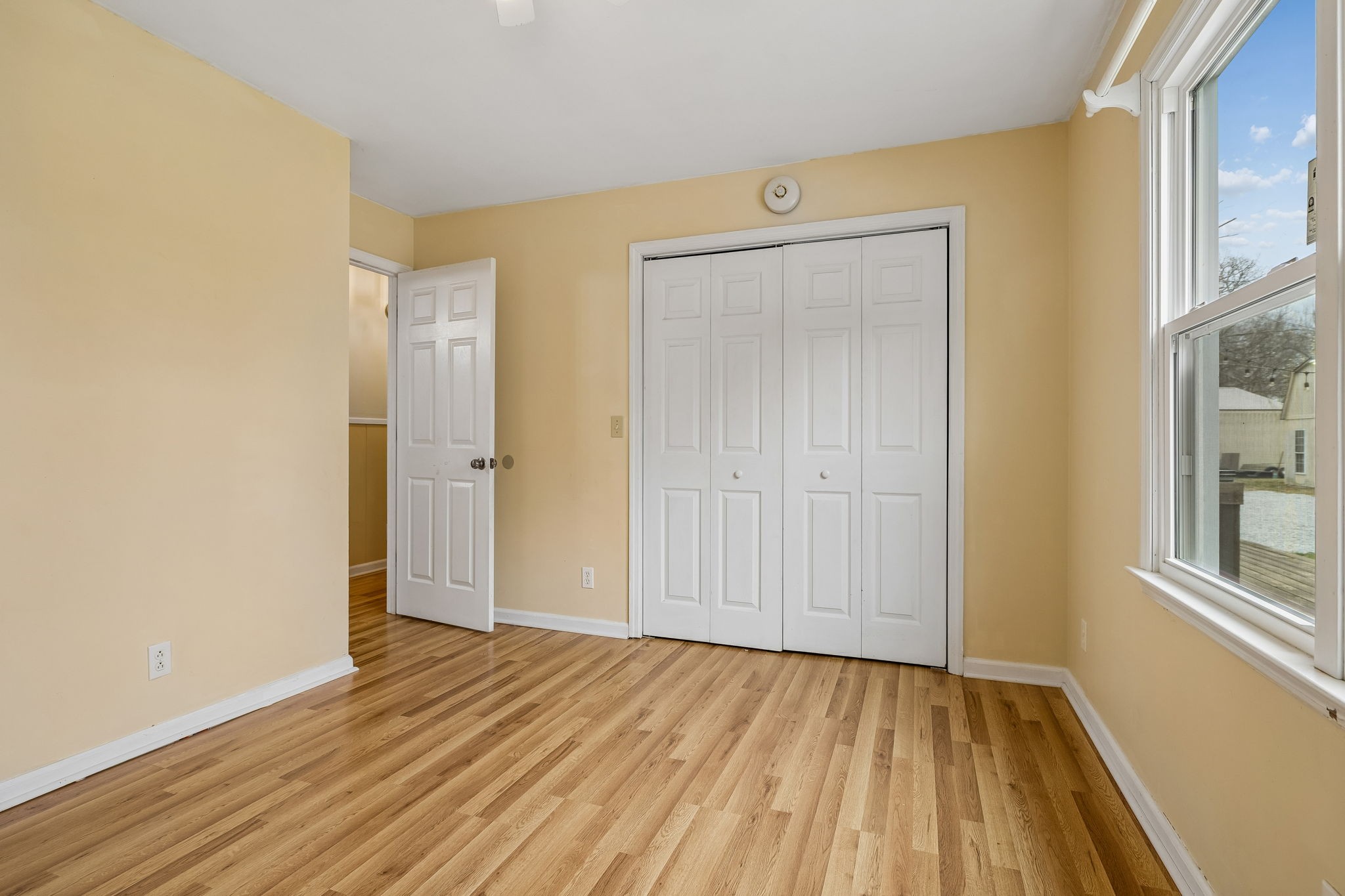3669 Bluff Springs Road McMinnville, TN 37110 - Photo 20 of 51 an empty room with wooden floor and windows
