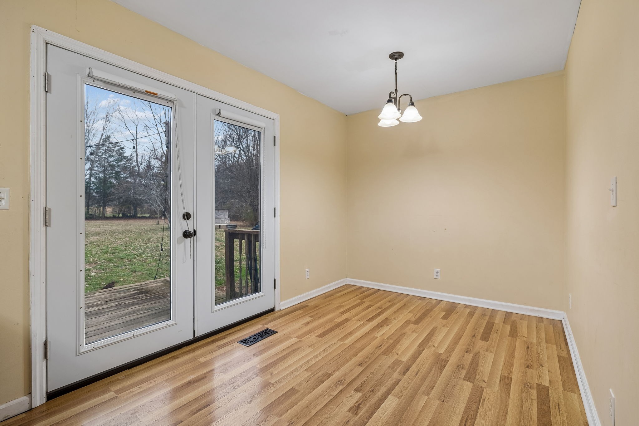 3669 Bluff Springs Road McMinnville, TN 37110 - Photo 21 of 51 a view of empty room with wooden floor and fan