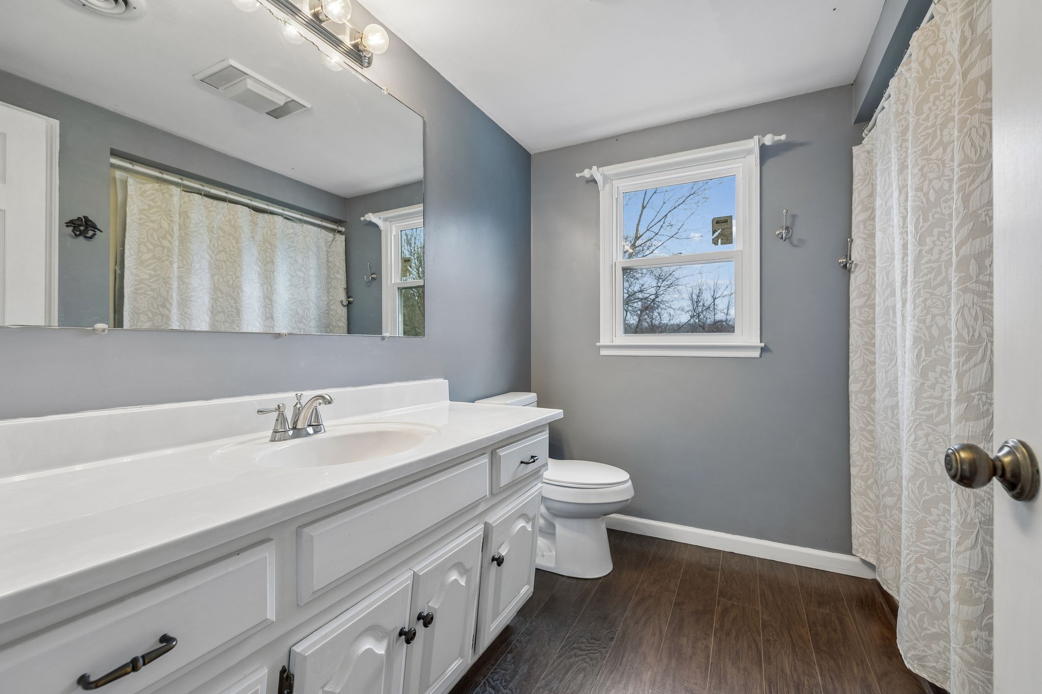 3669 Bluff Springs Road McMinnville, TN 37110 - Photo 30 of 51 a bathroom with a toilet sink and mirror