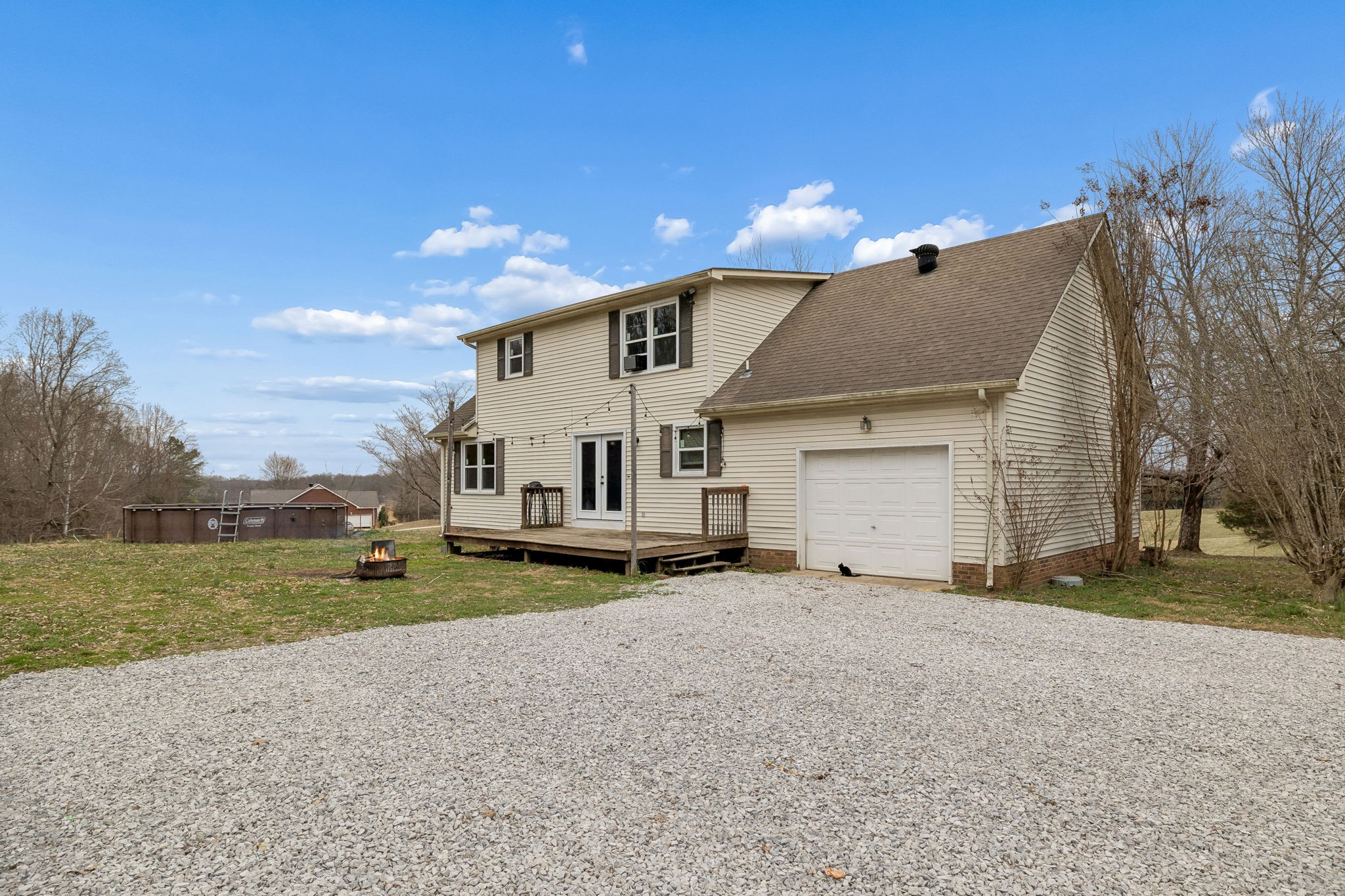 3669 Bluff Springs Road McMinnville, TN 37110 - Photo 35 of 51 a view of a house with a yard and a large tree