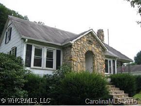 9 Frazier Road Canton, NC 28716 - Photo 1 of 1 a view of a brick house next to a yard