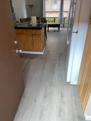 a view of kitchen with sink and window