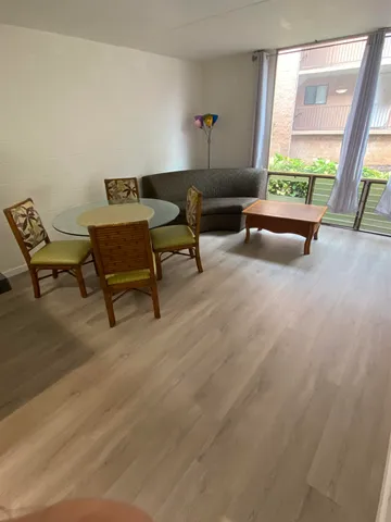 a living room with furniture and a window