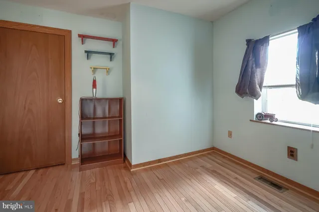 an aerial view of a house with garden space and a street view