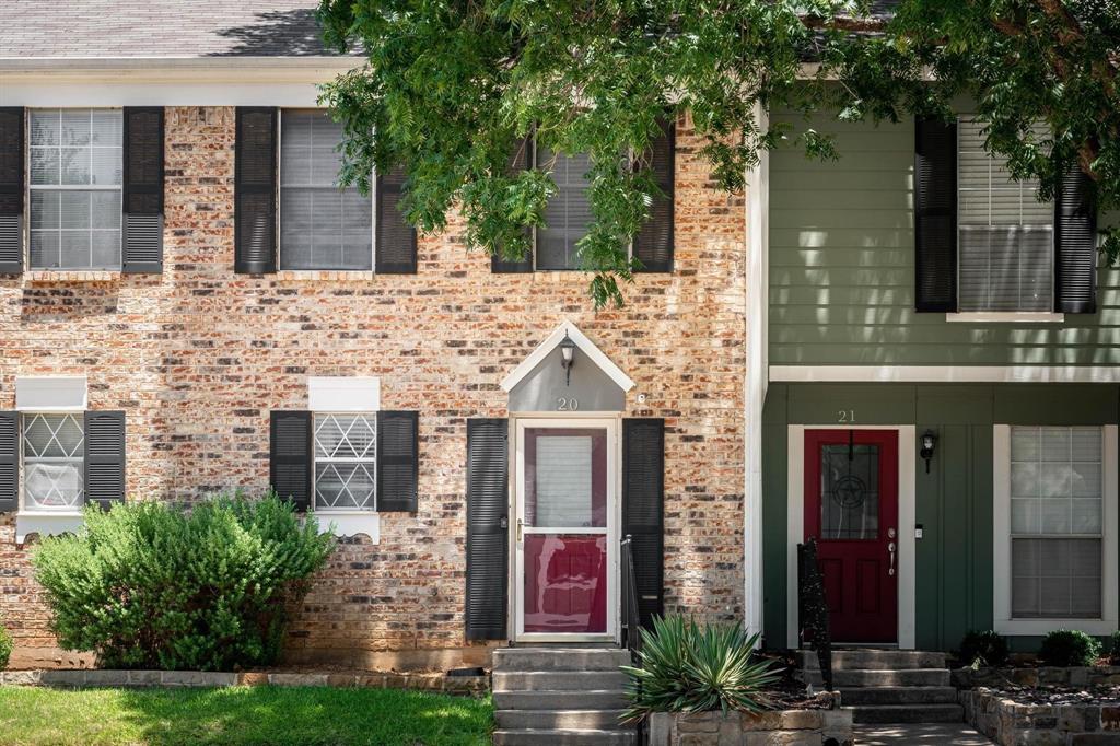20 Abbey Road Euless, TX 76039 - Photo 1 of 8 View of front of home with brick siding and board and batten siding