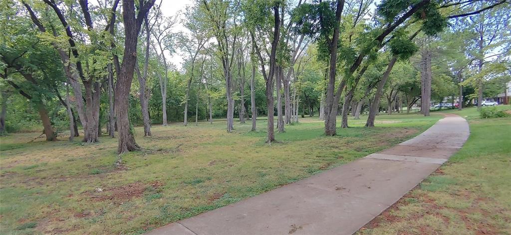20 Abbey Road Euless, TX 76039 - Photo 2 of 8 View of community featuring a yard
