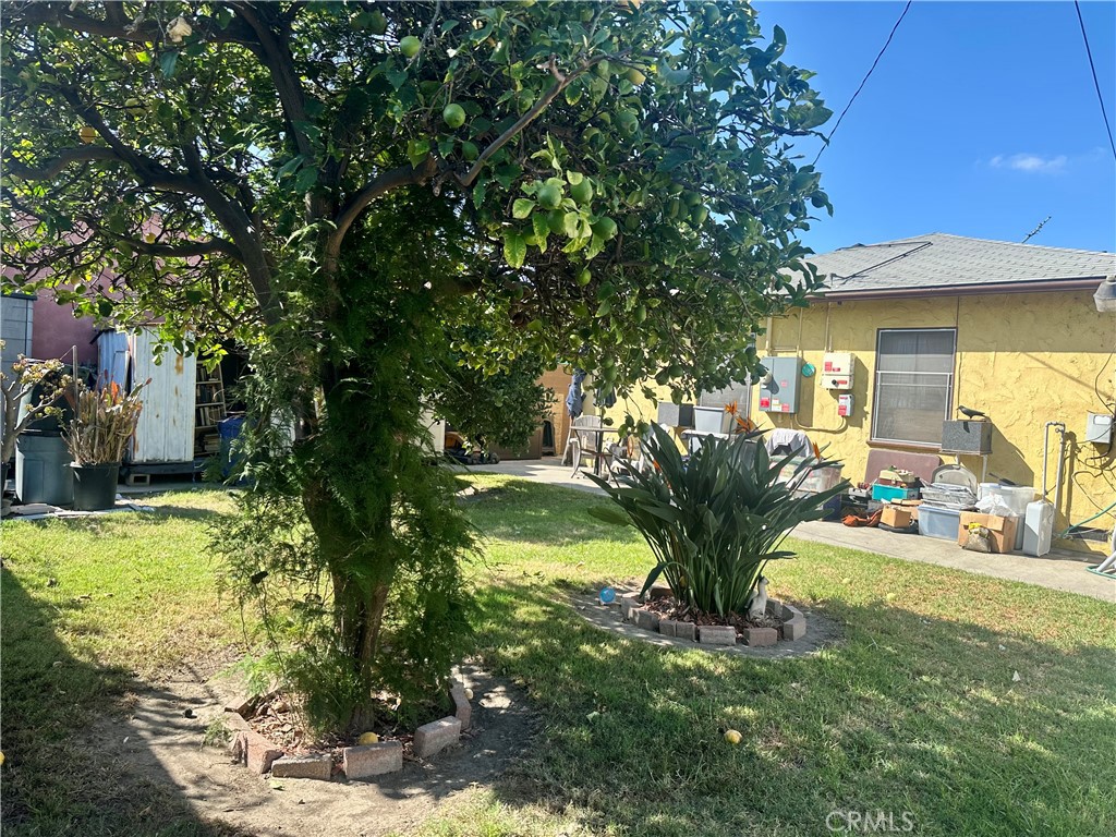 1106 South Washington Avenue Compton, CA 90221 - Photo 6 of 9 a view of a house with a yard