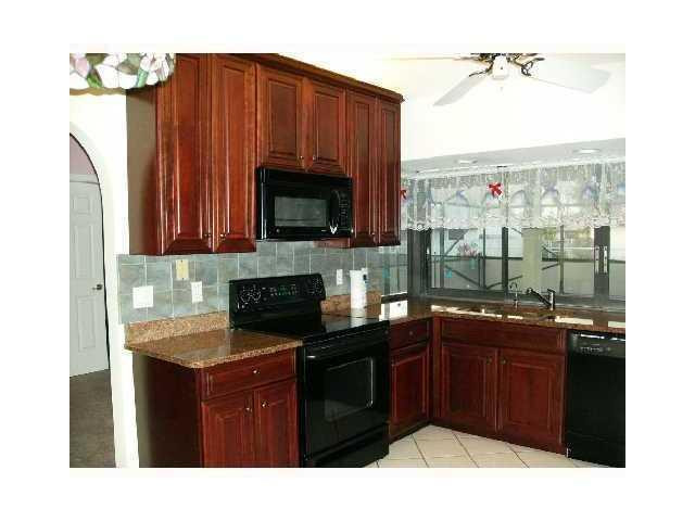 591 Southeast Ron Rico Terrace Port St. Lucie, FL 34983 - Photo 2 of 3 Kitchen